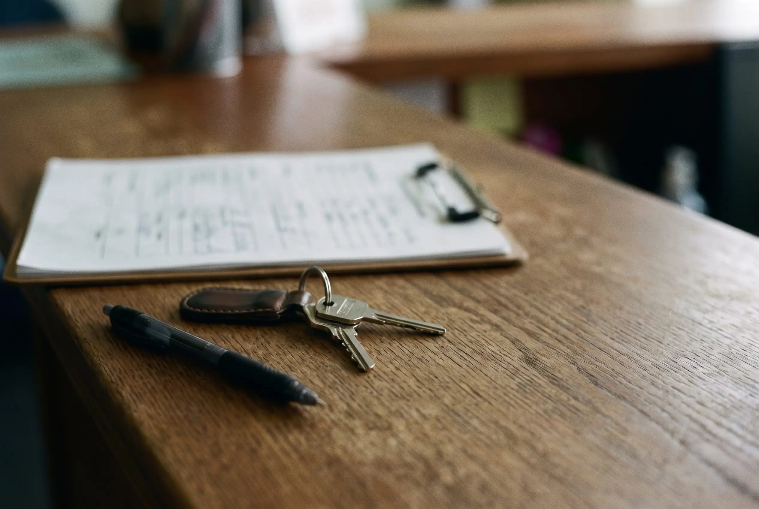 Quote paperwork and keys on a clean workshop counter